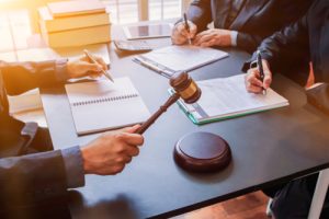Settling Out Of Court: Pros And Cons